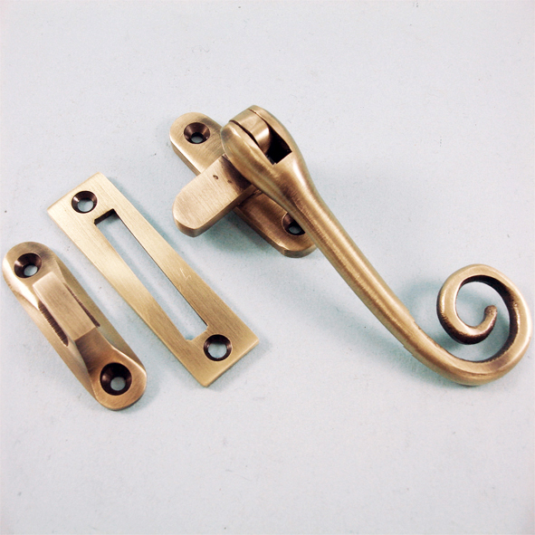 THD086/AB • Antique Brass • Curly Tail Casement Fastener